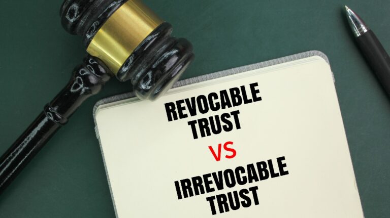 Judge's gavel, pen and book with the words Irrevocable Trust vs Revocable Trust
