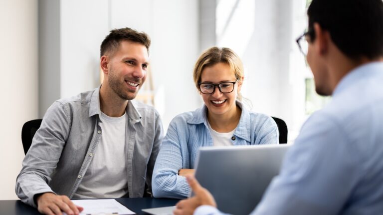 Young Couple Is Meeting With A Financial Planner To Discuss Their Future Investments